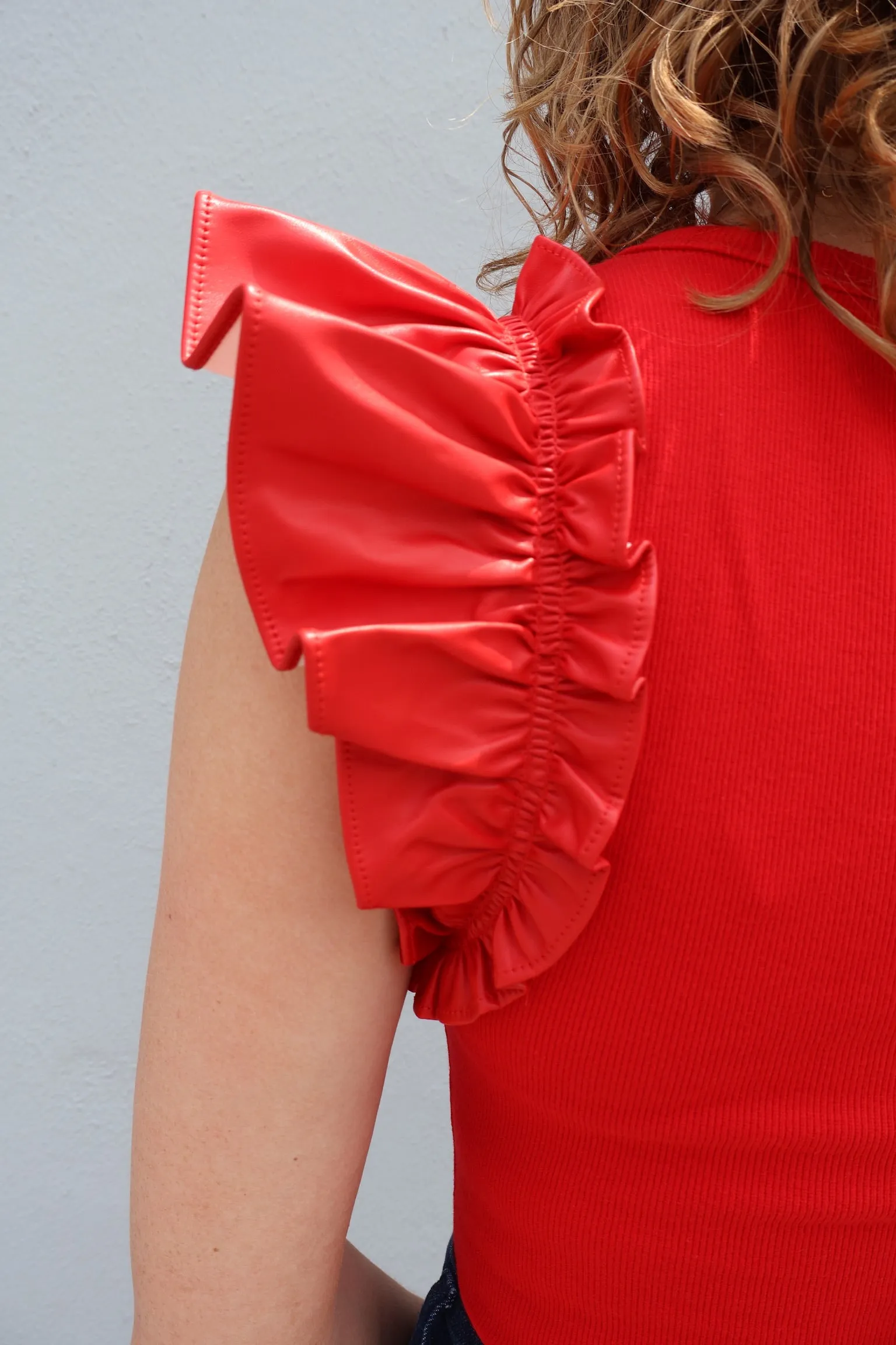 V-neck bodysuit with faux leather ruffle sleeves